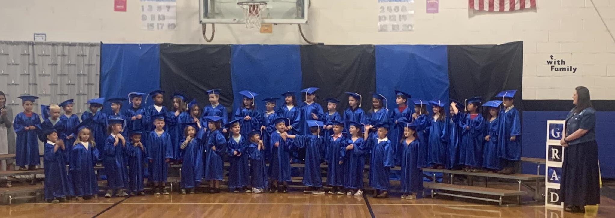 Pre k Graduation with all the students on the steps