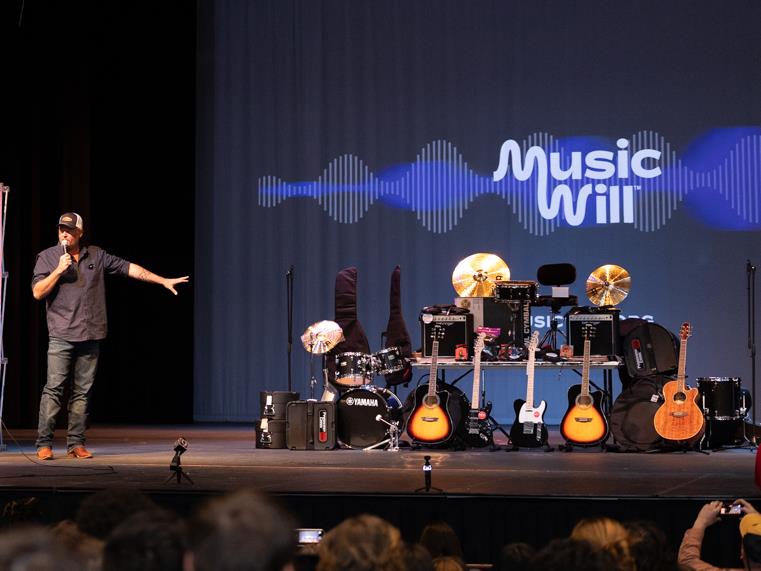 Blake Shelton gifting instruments to Ada High School.