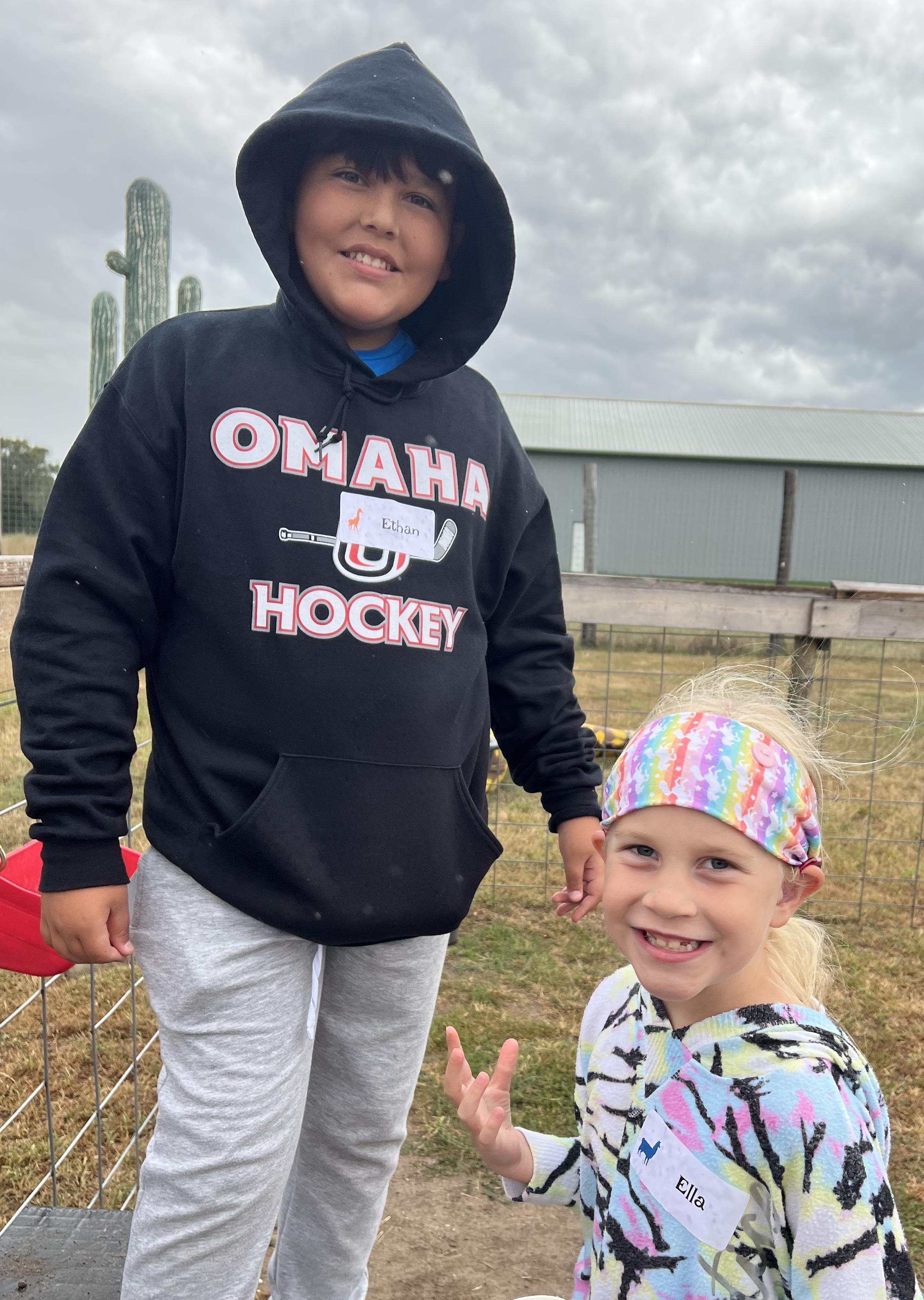 Boy and girl posing for a photo