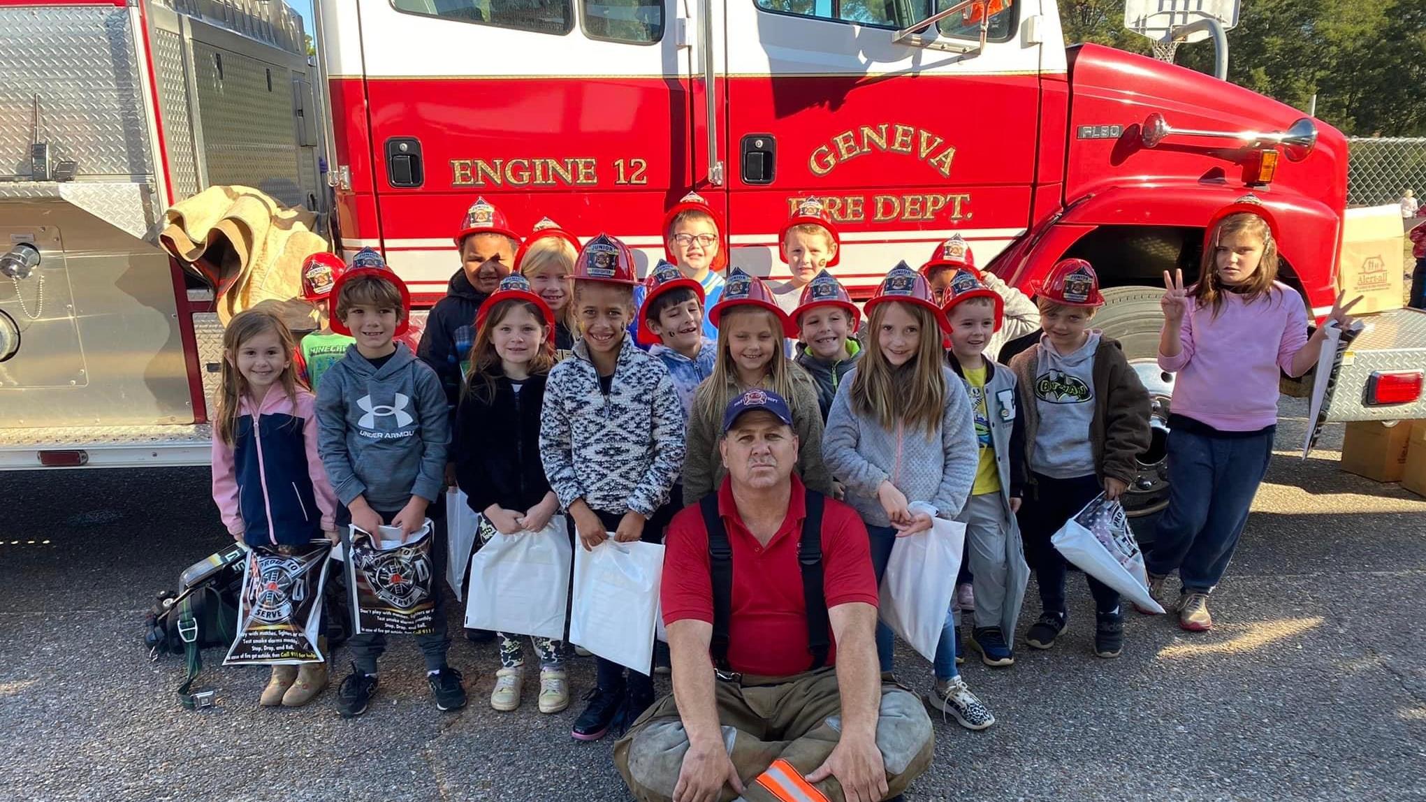 students with firefighter