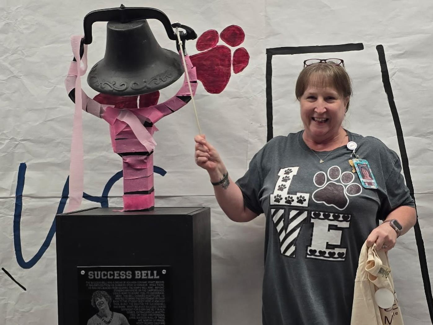 Mrs. Bathcelor rings the success bell after she was recognized as a Difference Maker in Ada City Schools District.