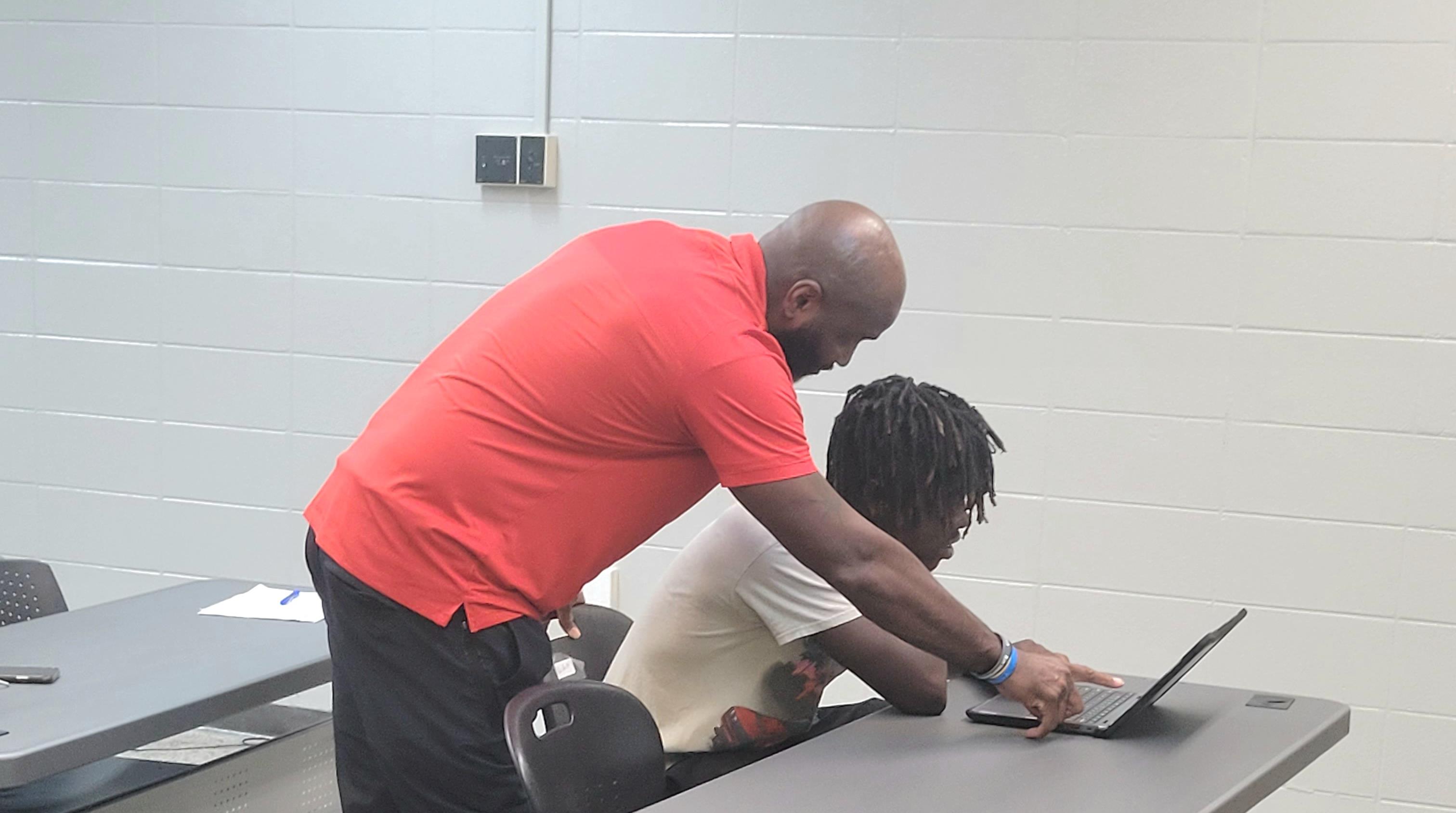 Teacher working with their student