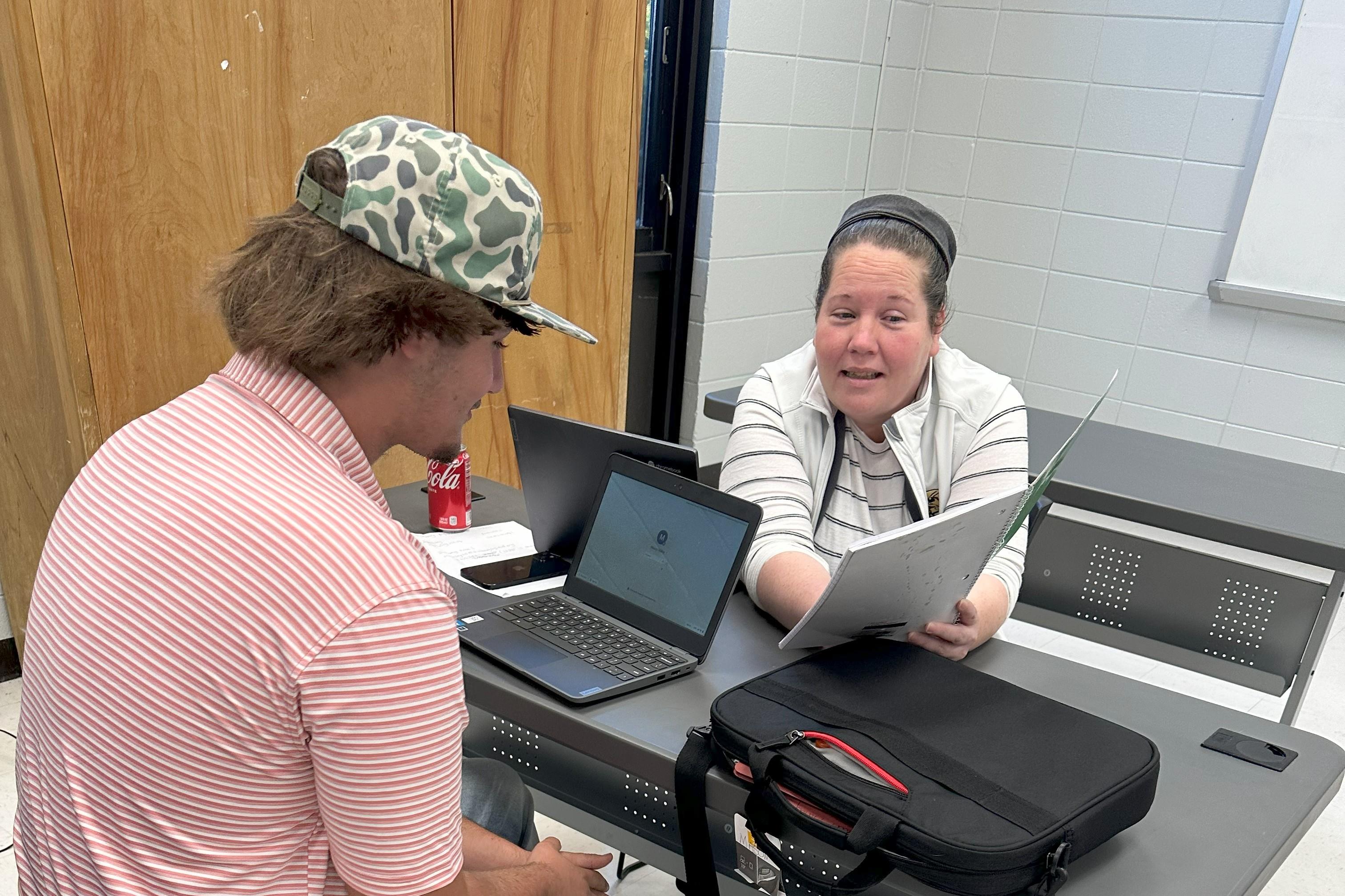 Teacher working with their student