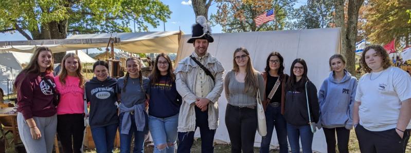 Students with Mr. Graves dressed in uniform at Massac County Encampment