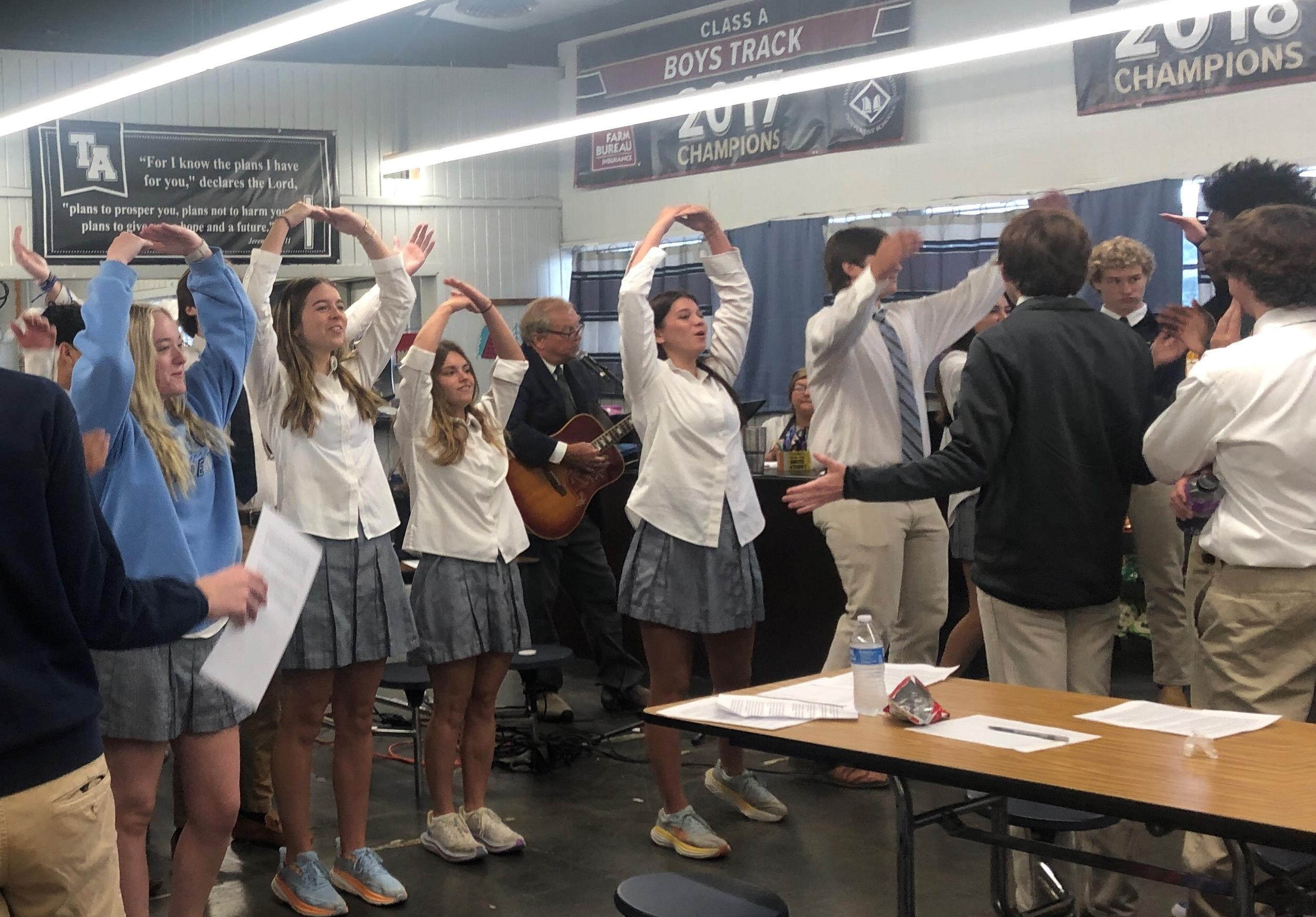 Seniors leading Chapel singing