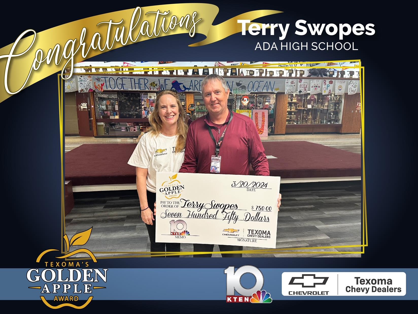 Terry Swopes receives a giant check for $750 for being Texoma's Golden Apple of the Month