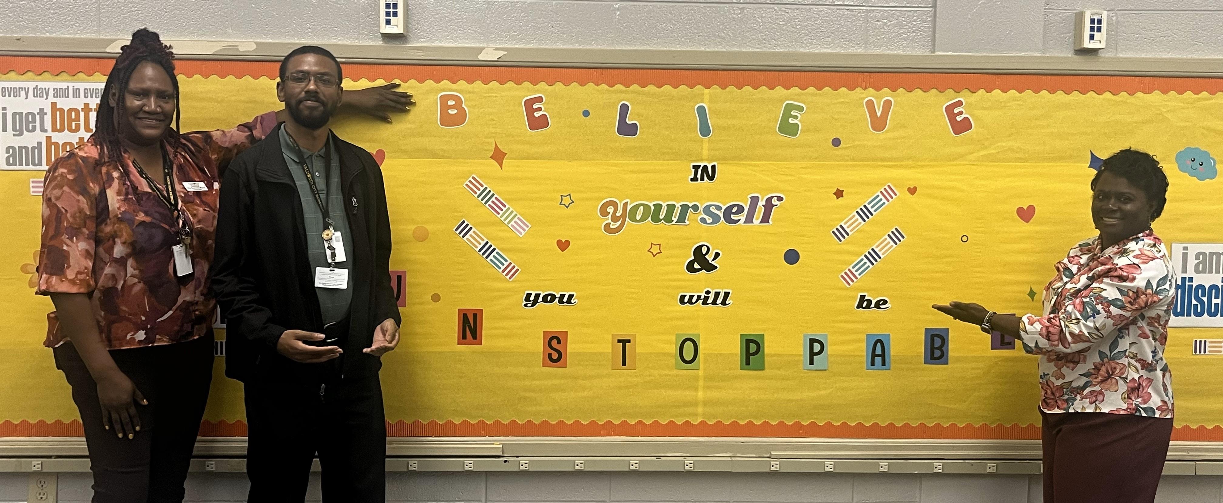 DRHS Staff with bulletin that reads Believe in yourself