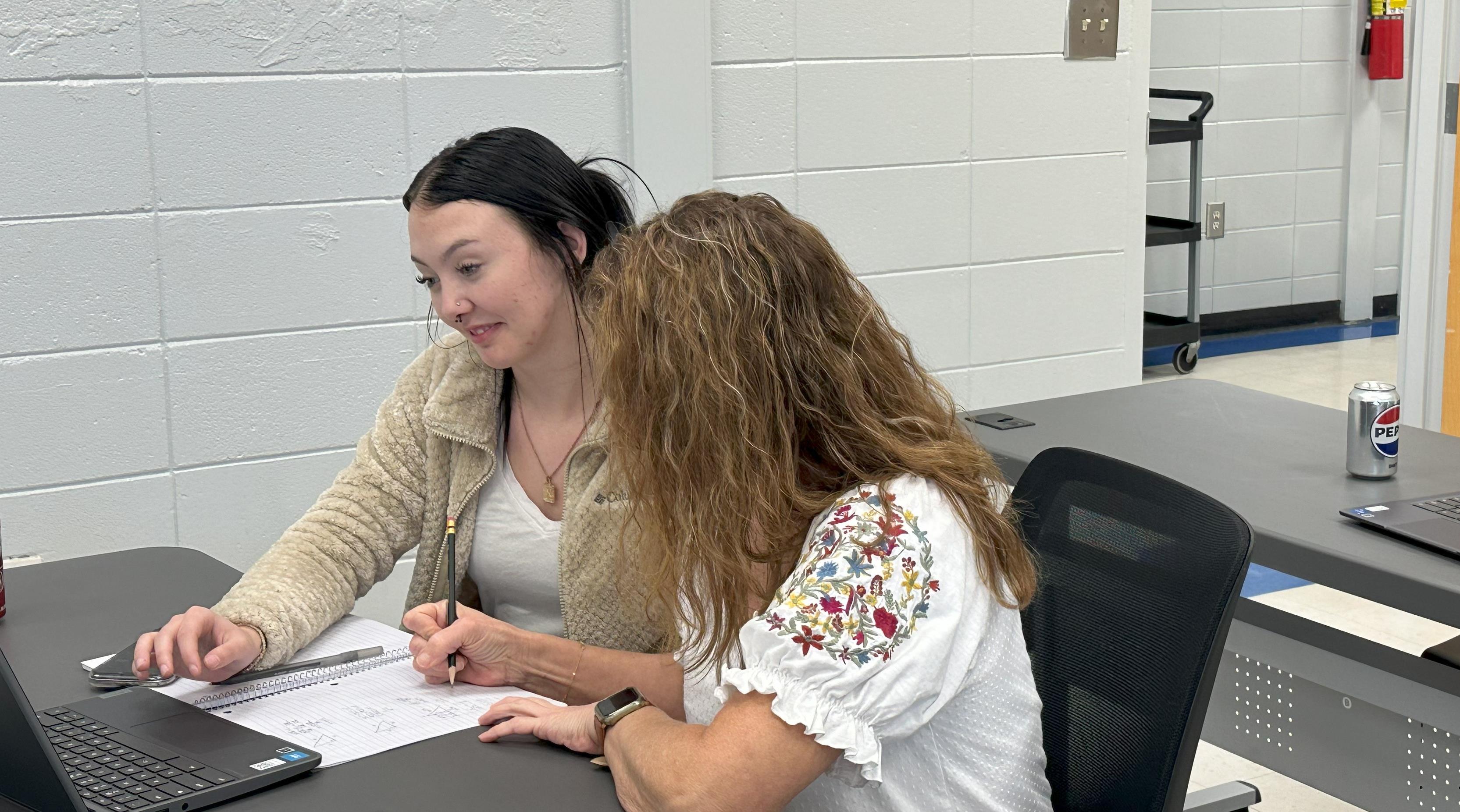 Teacher working with their student