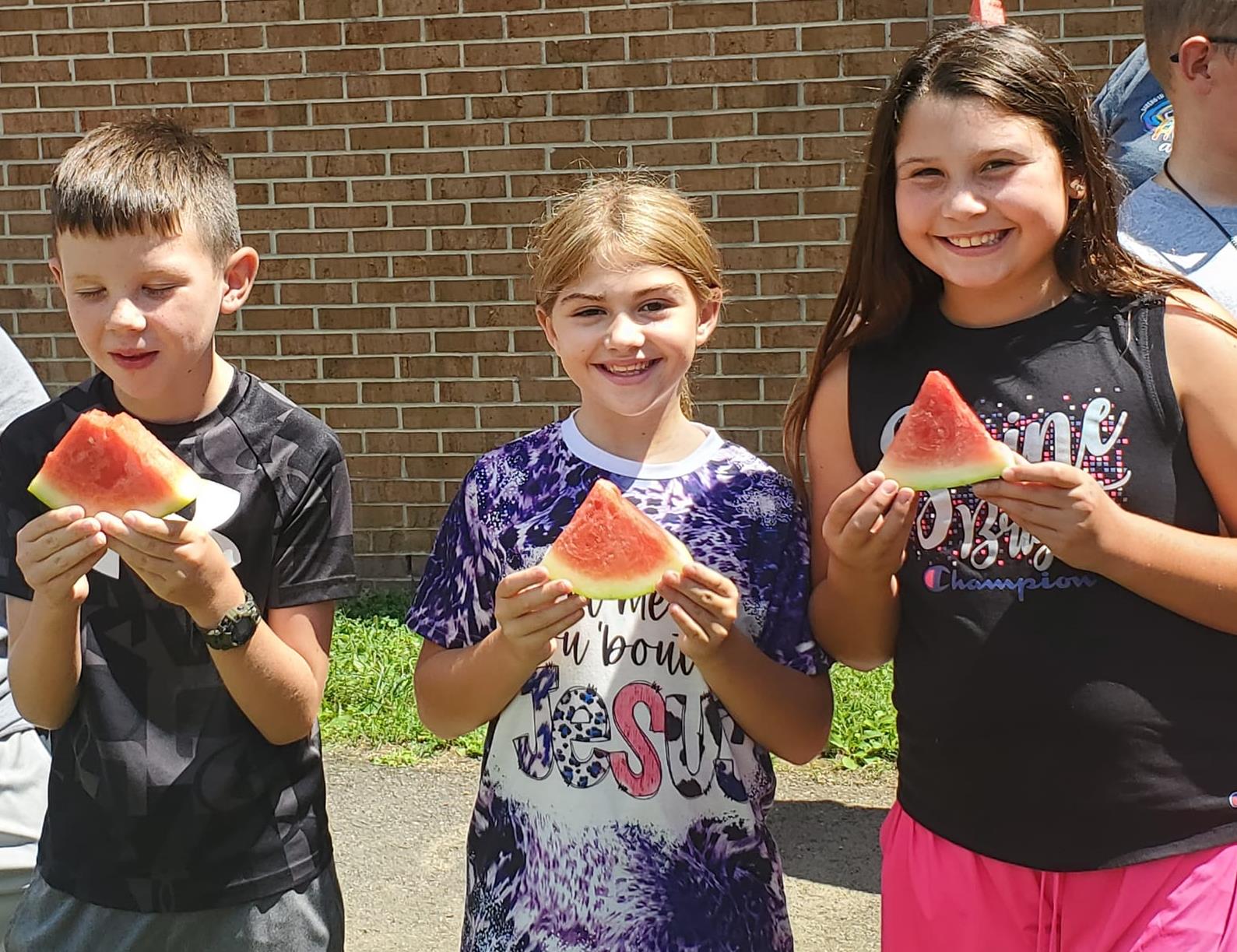 students eating watermelon