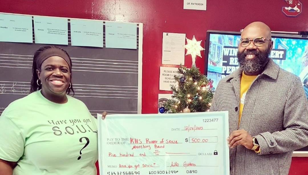 Teacher donates $500 to Kingstree High School Band Program