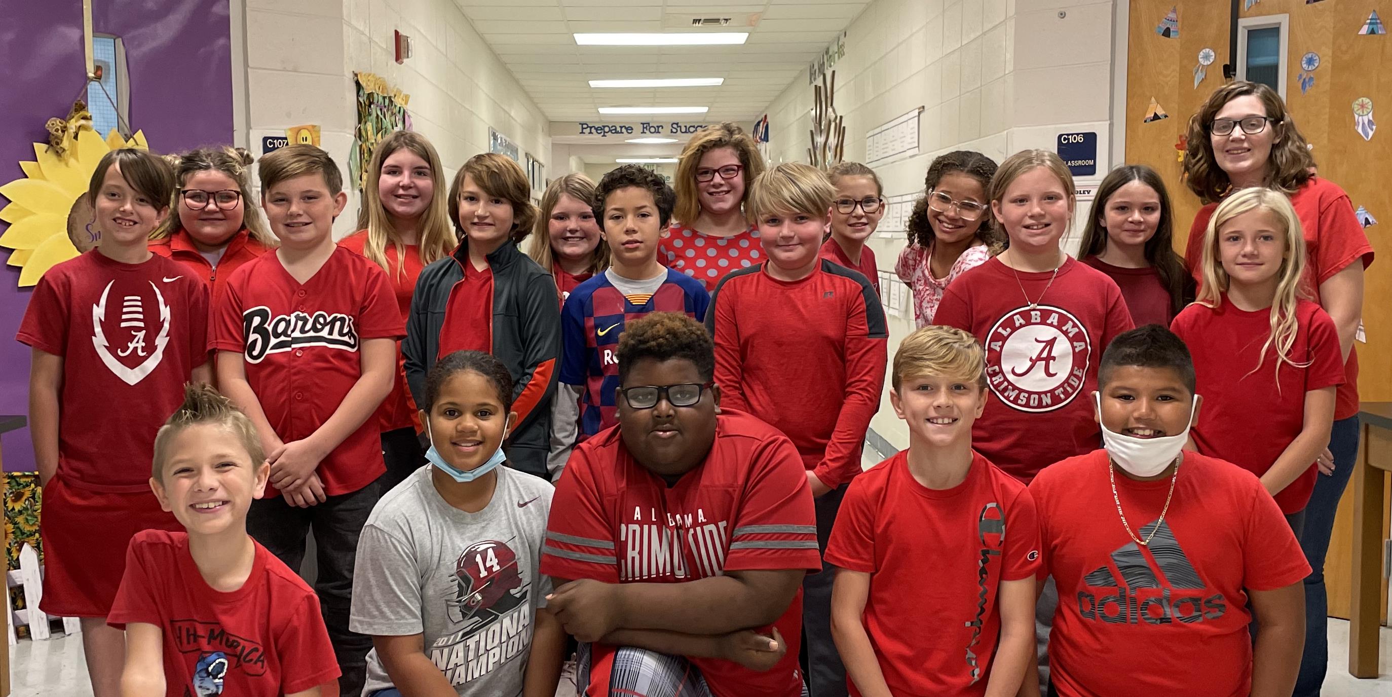 Mrs. McKee and her class showing off their Red for Red Ribbon Week
