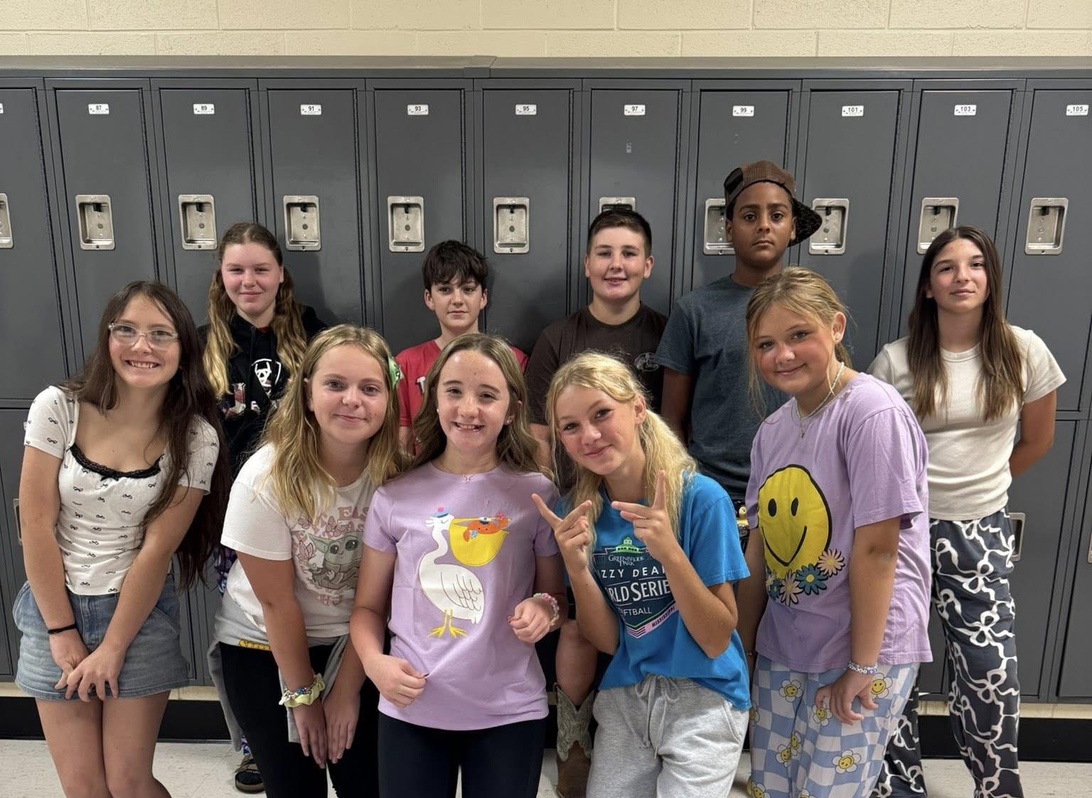 Group of students dressed in different pajamas being their "younger self" for homecoming.