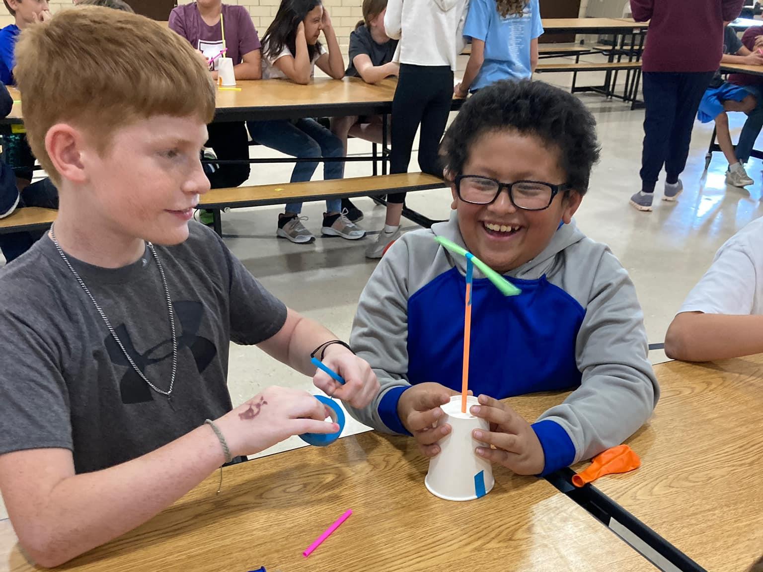 two students involved in a STEM activitiy