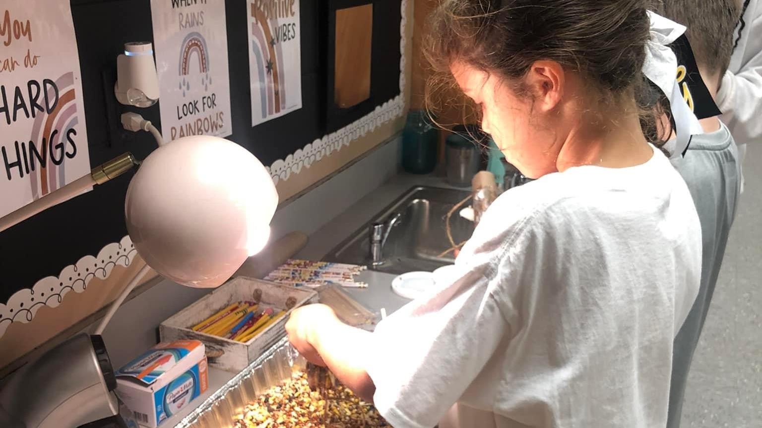 students making bird feeders