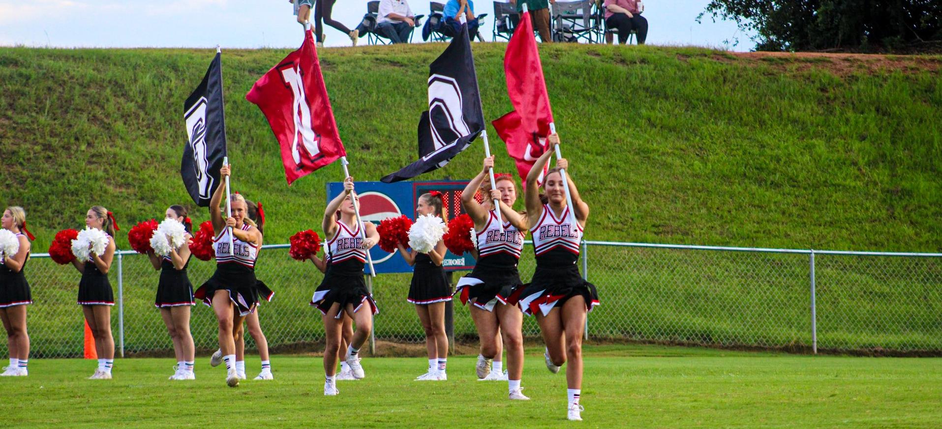 Cheerleaders Run Out