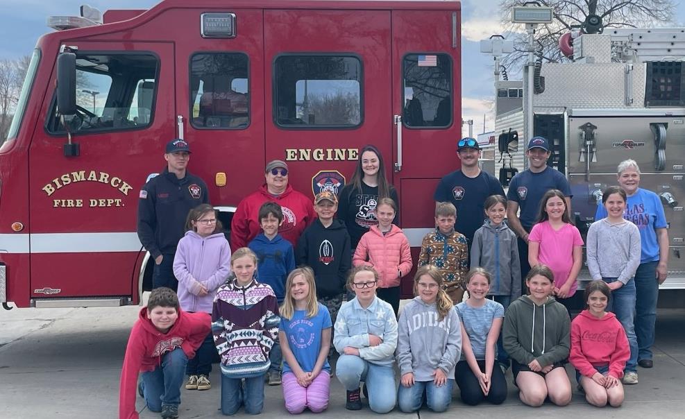 3rd and 4th grade in front of firetruck