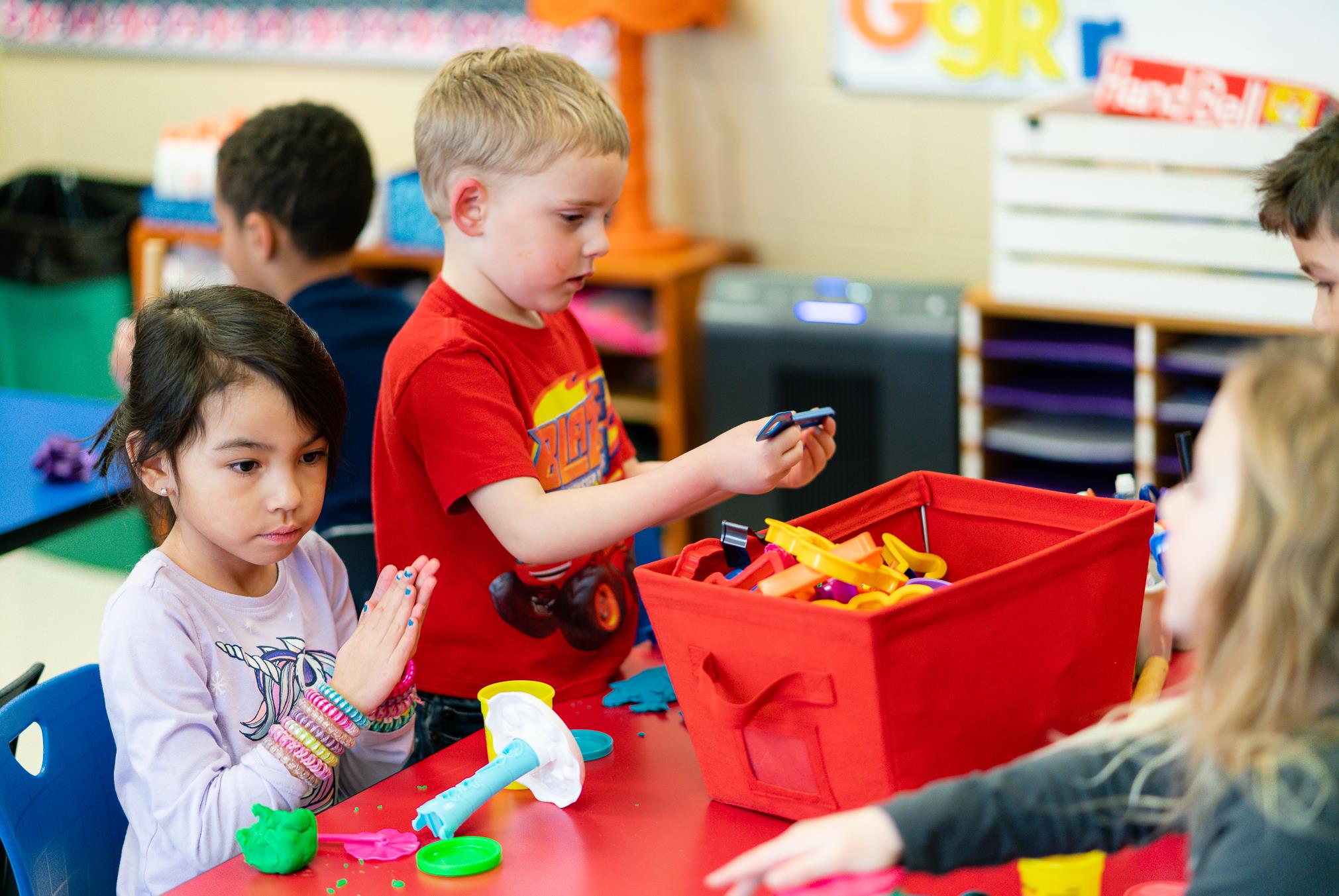 Students playing with playdough Students playing with playdough