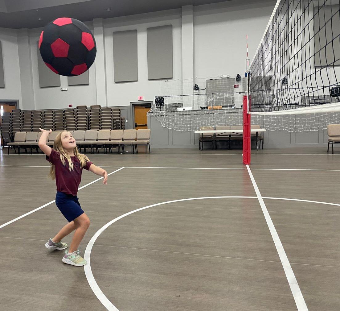 Lowers school student playing with large ball Lowers school student playing with large ball