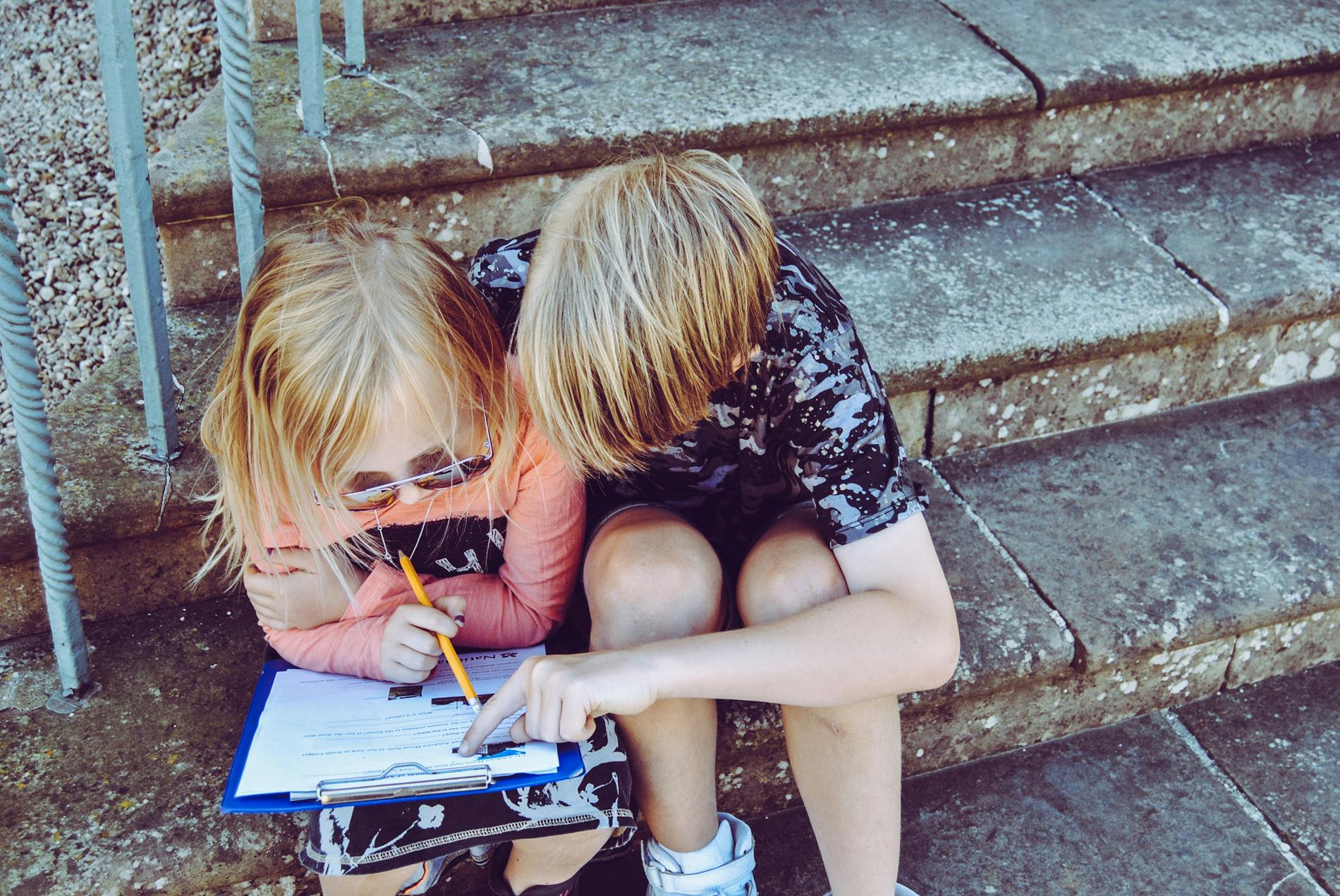 2 kids with a clipboard