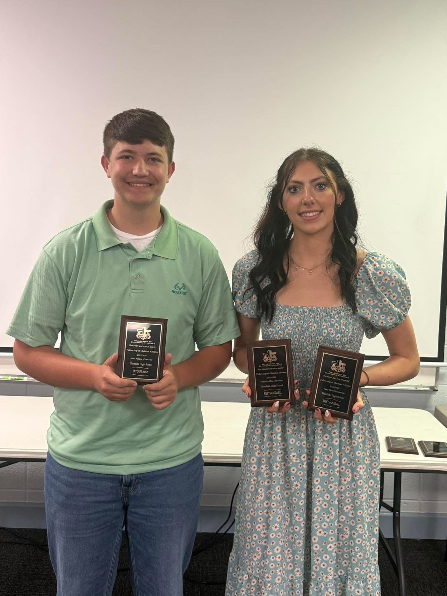 photo of Jayden May and Riley Maxwell with their certificates for being selected as the Huntland Male and Female Athletes of the year at the recent FCA Awards Program.