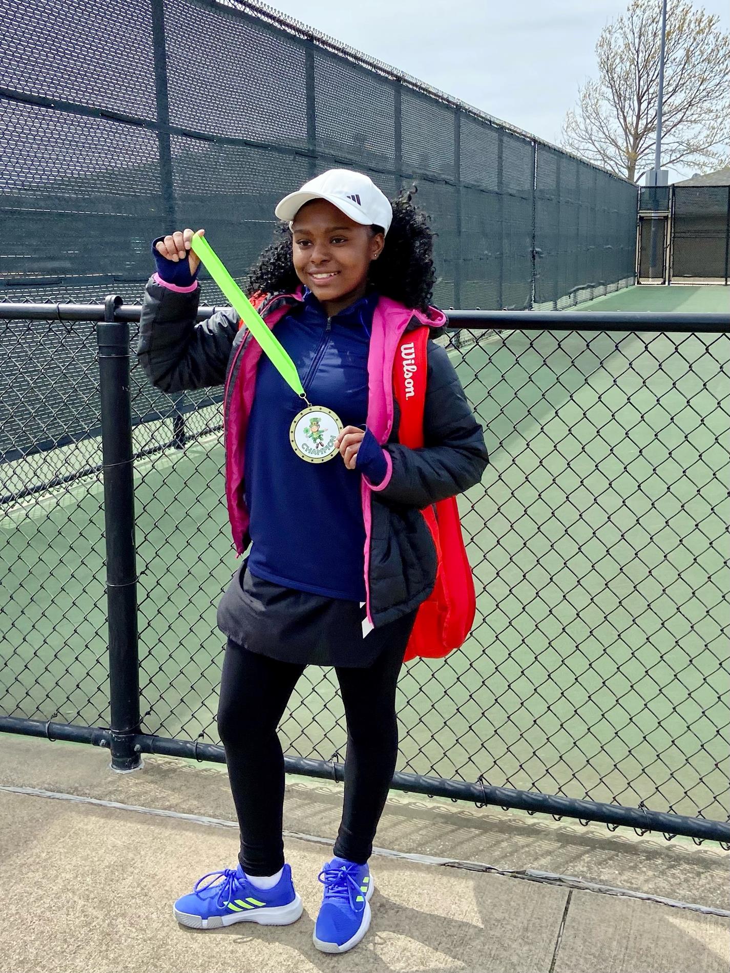 photo of Mya with tennis racket 