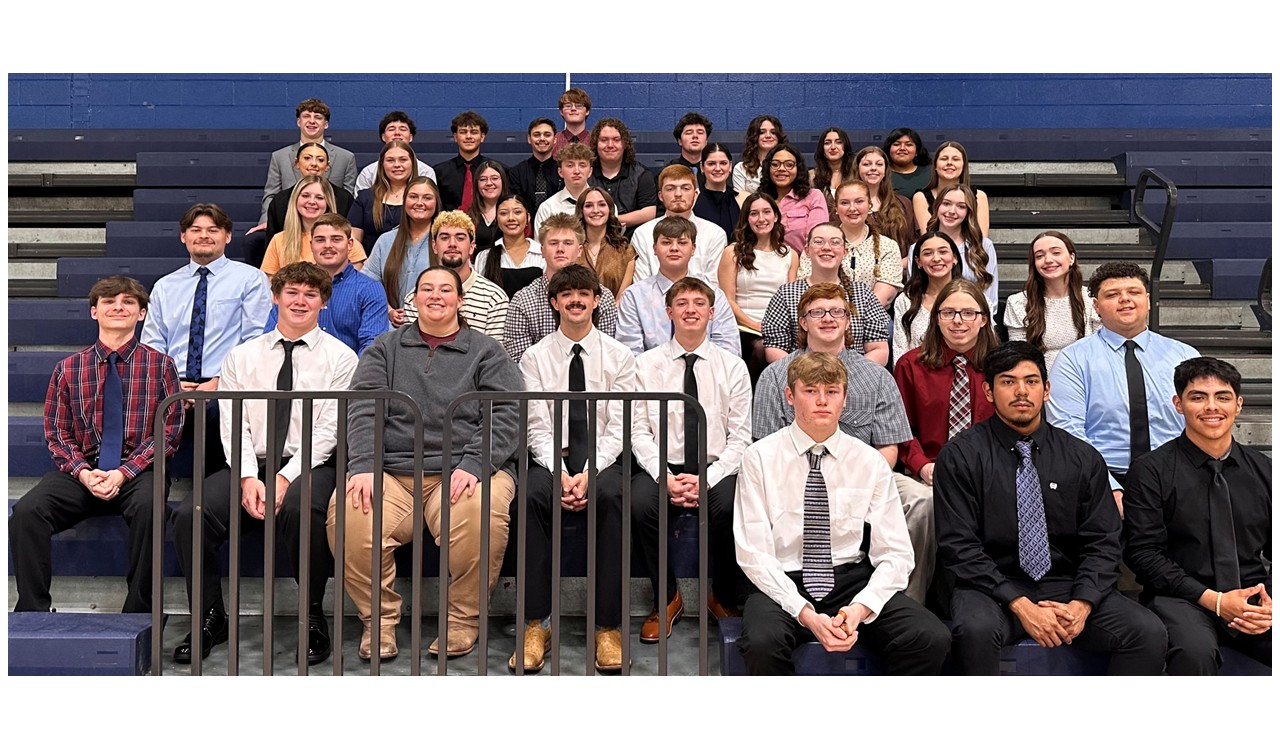 Photo of Seniors (Class of 2026) After completing Mock interviews, sitting together in the gym on the bleachers, smiling for a photo.