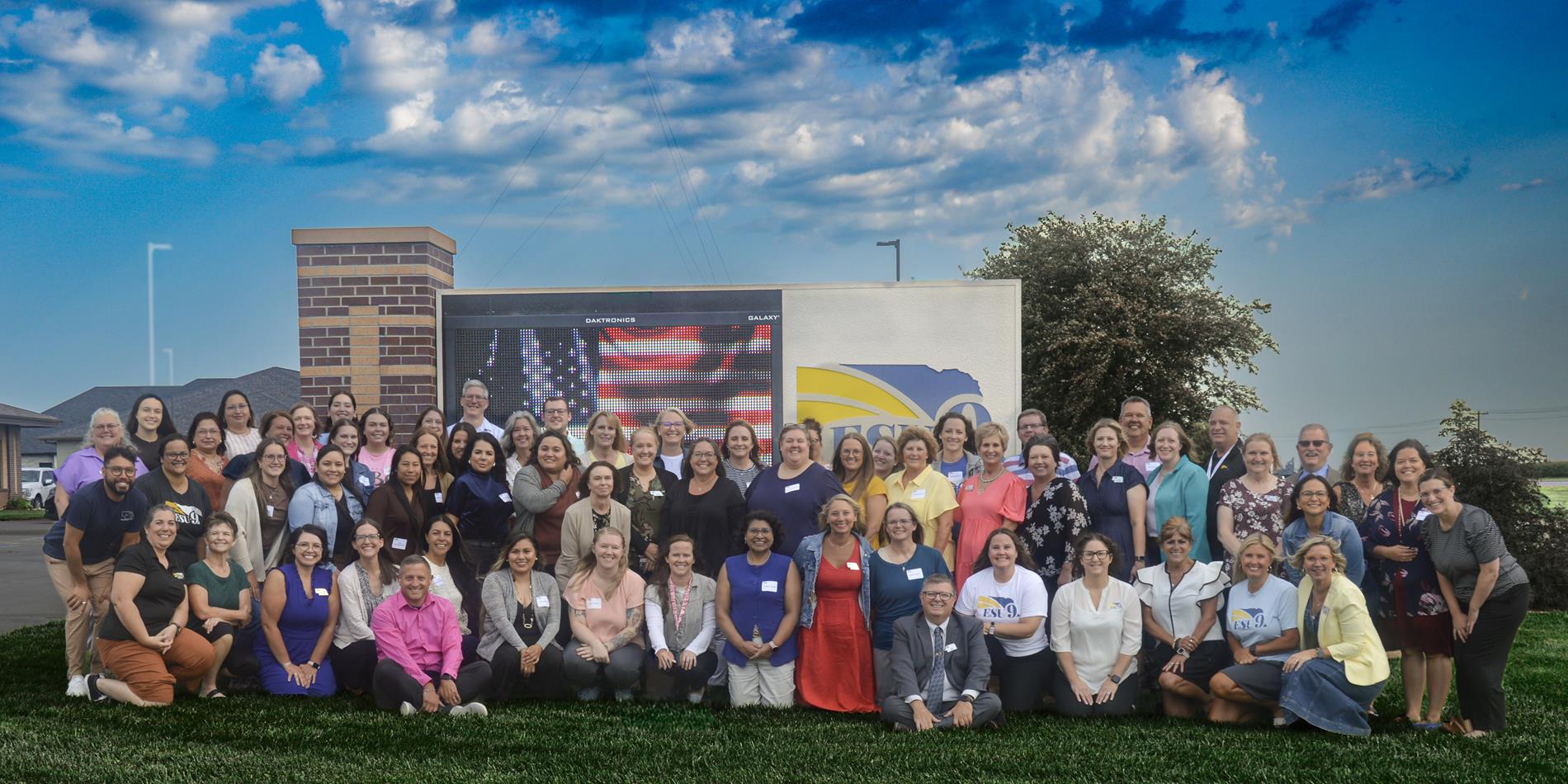 ESU 9 All Staff Members in front of sign