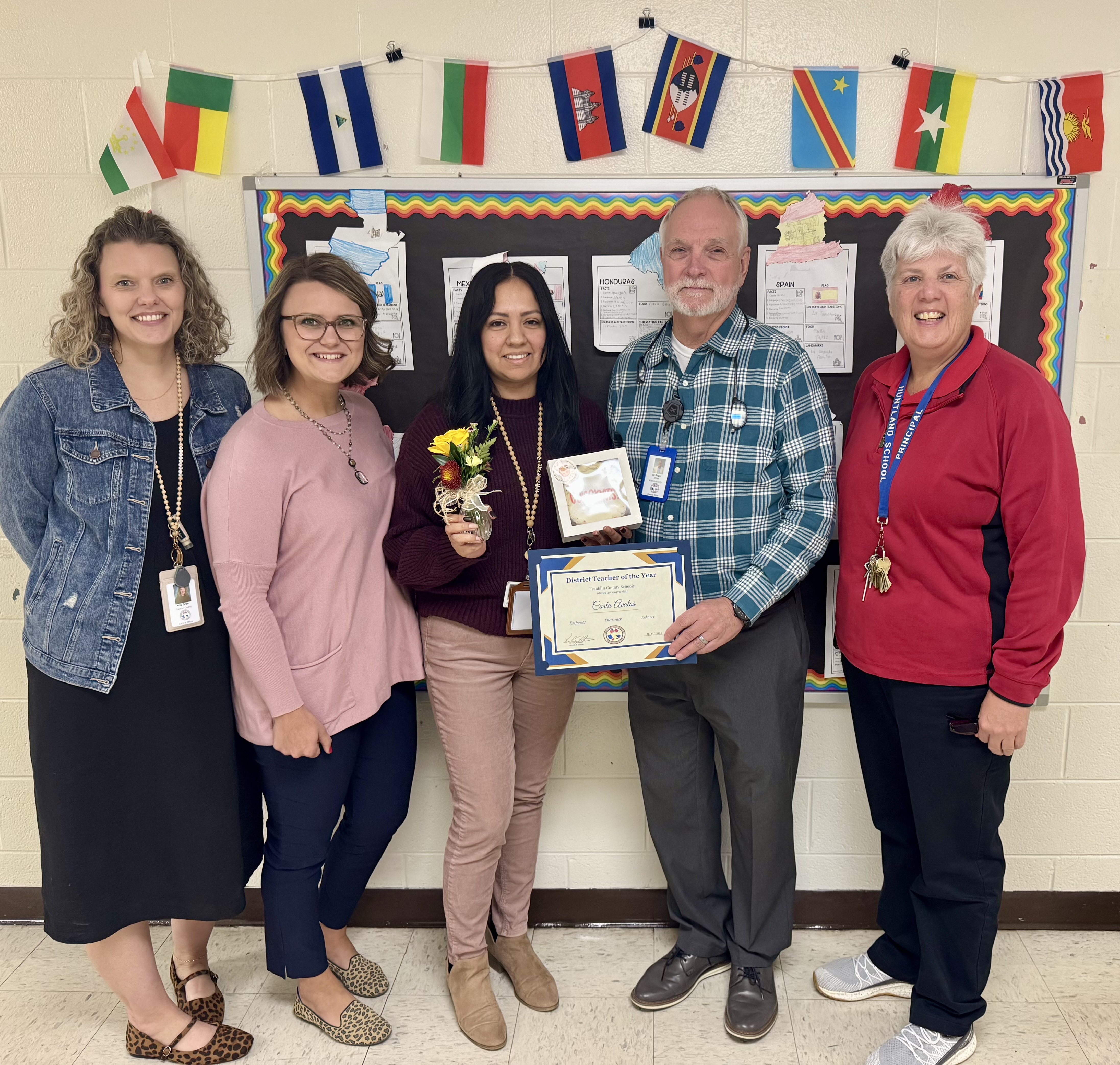 Picture is Carla Avalos being presented Franklin County District Middle School Teacher of the Year for 2025-2025. From left to right is Amy Greer Elementary-Supervisor/Data Specialist/Testing Coordinator, Rachel Shields-District Supervisor, Carla Avalos-Huntland Middle School EL Teacher, Dr. Roger Alsup-Director of Human Resources/Deputy Director of Schools, Lisa Crabtree- Huntland School Principal