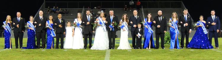 This is a photo of the members of the 2025 Homecoming court, they include, from left, sixth-grade attendant Harper Cundiff, escort TJ Cundiff, eighth-grade attendant Kennedy Morris, escort Phillip Morris, 10th-grade attendant Dawt Par, escort Nathan Kumthar, flower girl Mary Claire Sims, queen candidate Abigail Drake, escort David Drake, Queen Analyn Riddle, escort Scottie Riddle, queen candidate Ali Smith, escort Jonathan Smith, crown bearer Jonah Fletcher, 11th-grade attendant Anniston Worley, escort Richard Worley, ninth-grade attendant Peyton Henry, escort David Henry, seventh-grade attendant Jentri Fanning and escort Chris Fanning.  Staff Photo by Sam Cowan