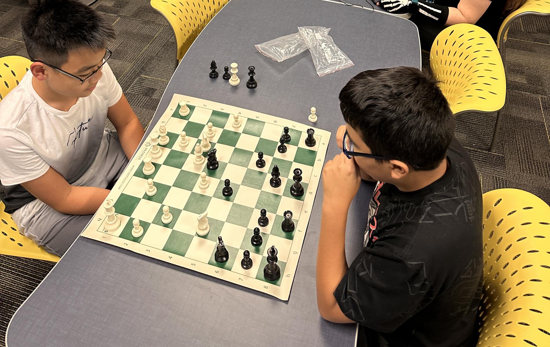 Two students playing chess